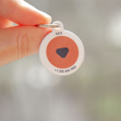 QR code pet id tag with red logo | Animal-id.net